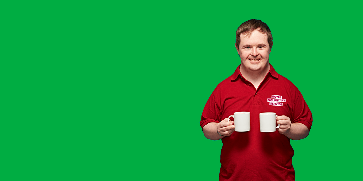 Portrait of volunteer Jonathan against an green background 