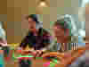 A group of people in a craft session 