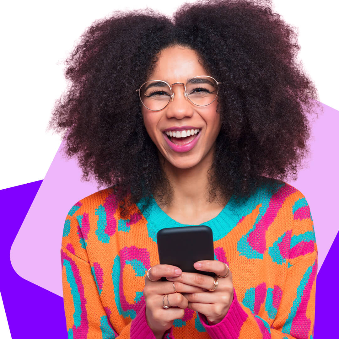 Cut out style image of a smiling young girl in brightly coloured clothes and glasses looking at the camera while texting 