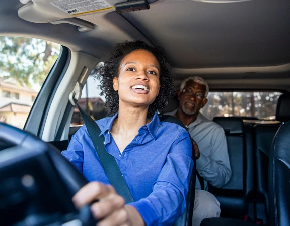 A volunteer giving a client a lift