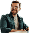 A cut out image of a smiling man with a beard 