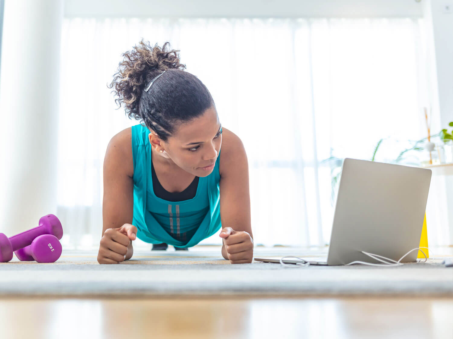 A woman taking part in an online session on the Virtual Village Hall 