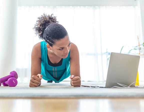 A woman taking part in an online session on the Virtual Village Hall