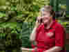 A older female volunteer supporting someone from loneliness by having a chat on the phone 