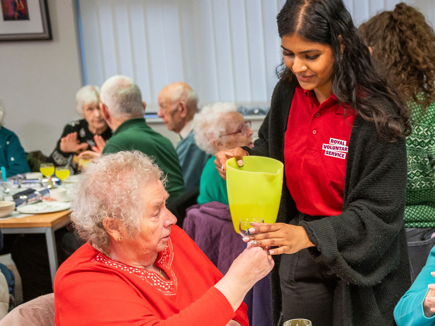 Volunteers serving lunch at the Hanley Centre