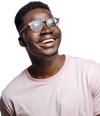 A cut out image of a man wearing glasses in a Tshirt smiling 
