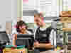 Royal Voluntary Service volunteers supporting at a cafe in an NHS hospital 
