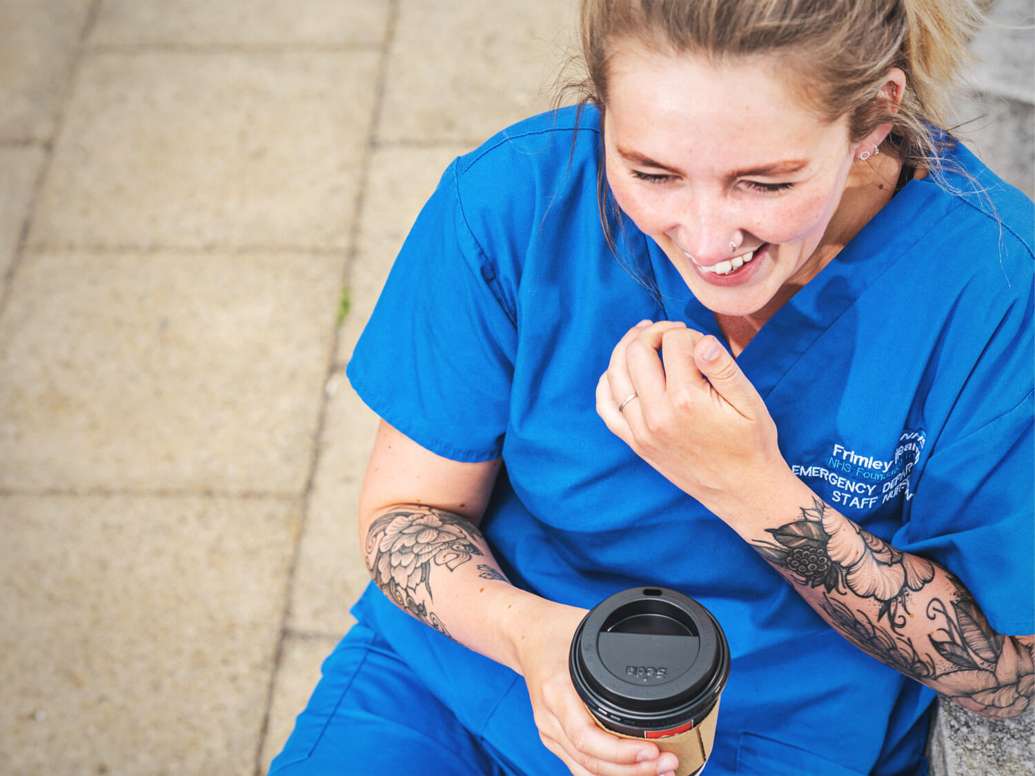 NHS worker drinking a hot drink