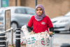 A Royal Voluntary Service pushing a shopping trolley while carrying out community services