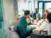 A group of professionals workig at a round table in a meeting