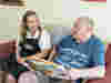 A volunteer supporting a client at a Royal Voluntary Service social club 
