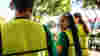 A group of work colleagues volunteering together earing hiviz vests