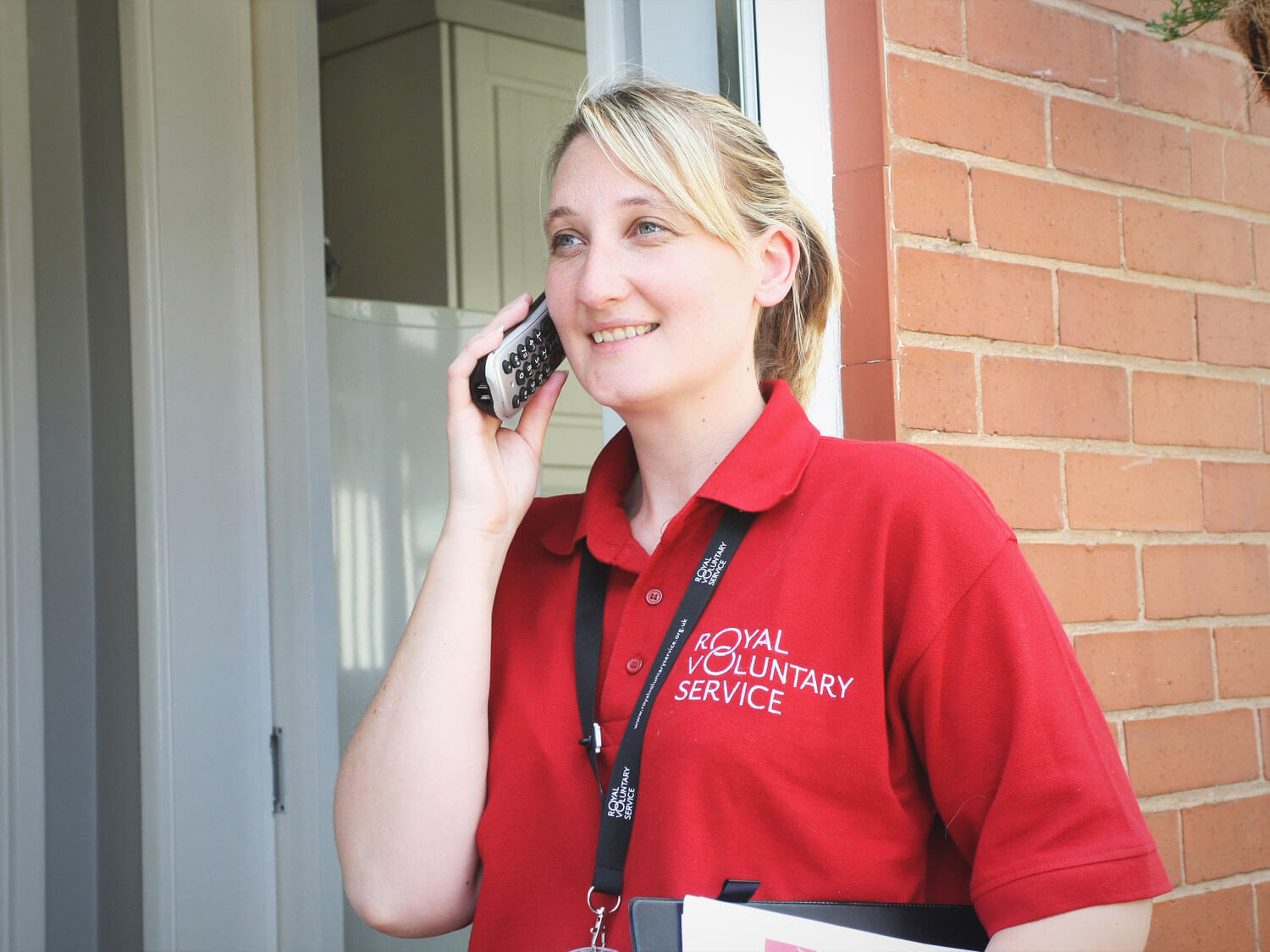 Royal Voluntary Service volunteer talking on the phone