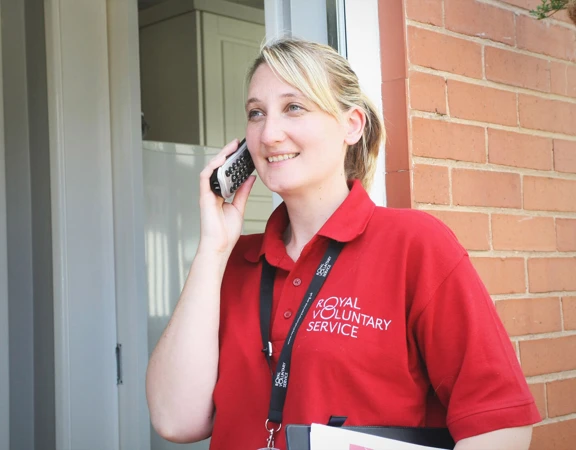 Royal Voluntary Service volunteer talking on the phone