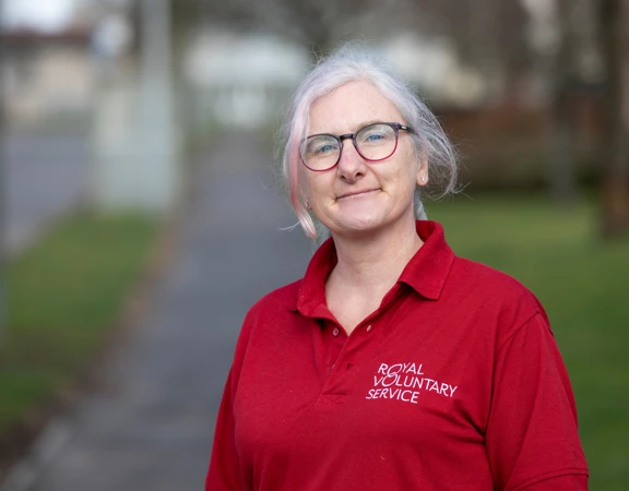 Royal Voluntary Service volunteer smiling