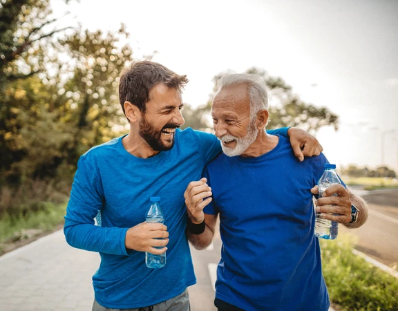 Two men on a run encouraging each other on