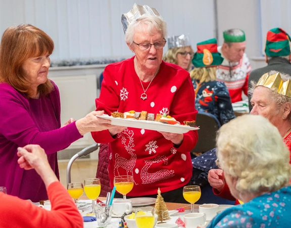 Celebrating a Christmas meal with friends