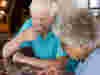 Two people concentrating while doing a jigsaw